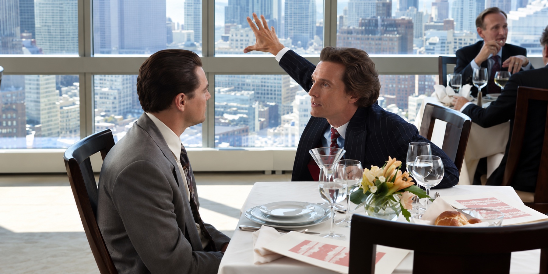 Two finance professionals in conversation over lunch