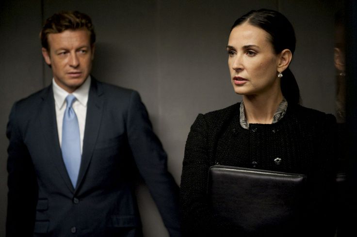 Two executives walking through an office