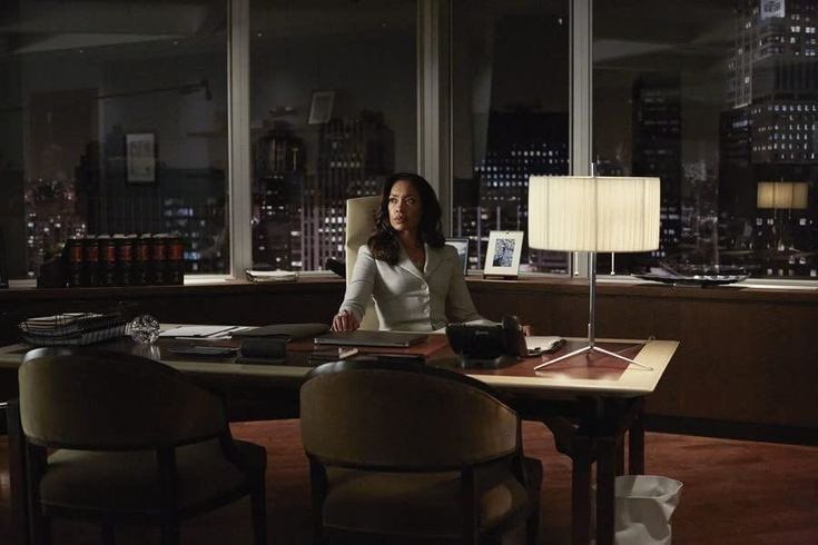 Woman working in a city office at night